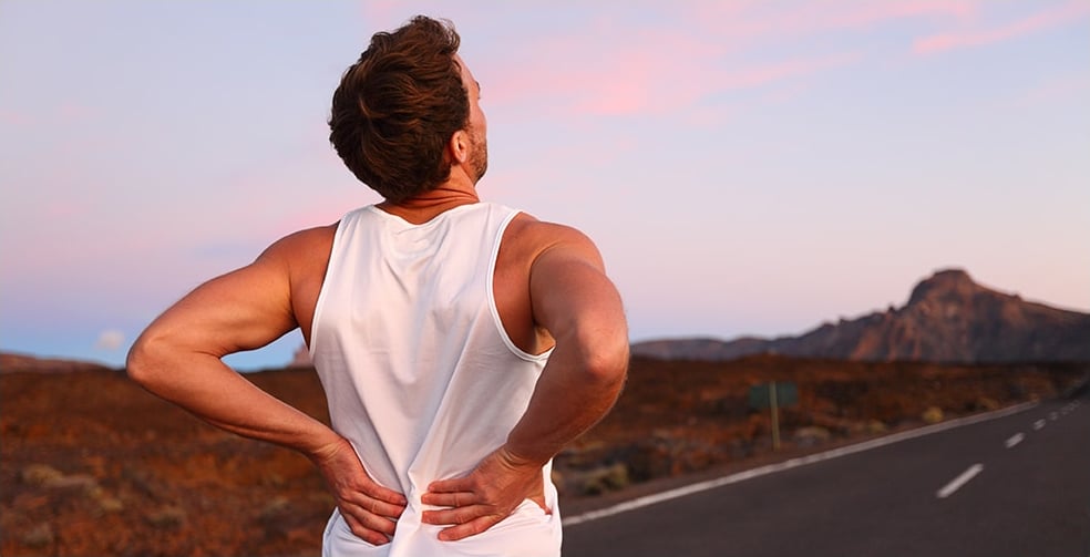 Athletic man with back pain.