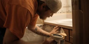Painting a bathroom.