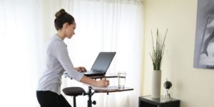 Woman at standing desk.