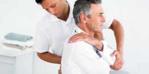 Chiropractor and patient.