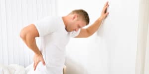 Man having a muscle spasm.