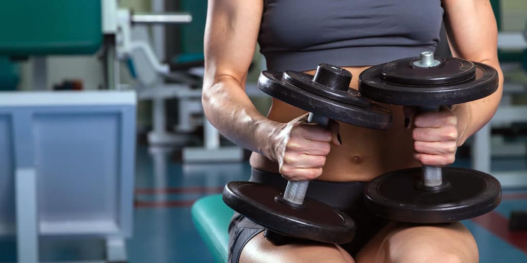 Person with weights.