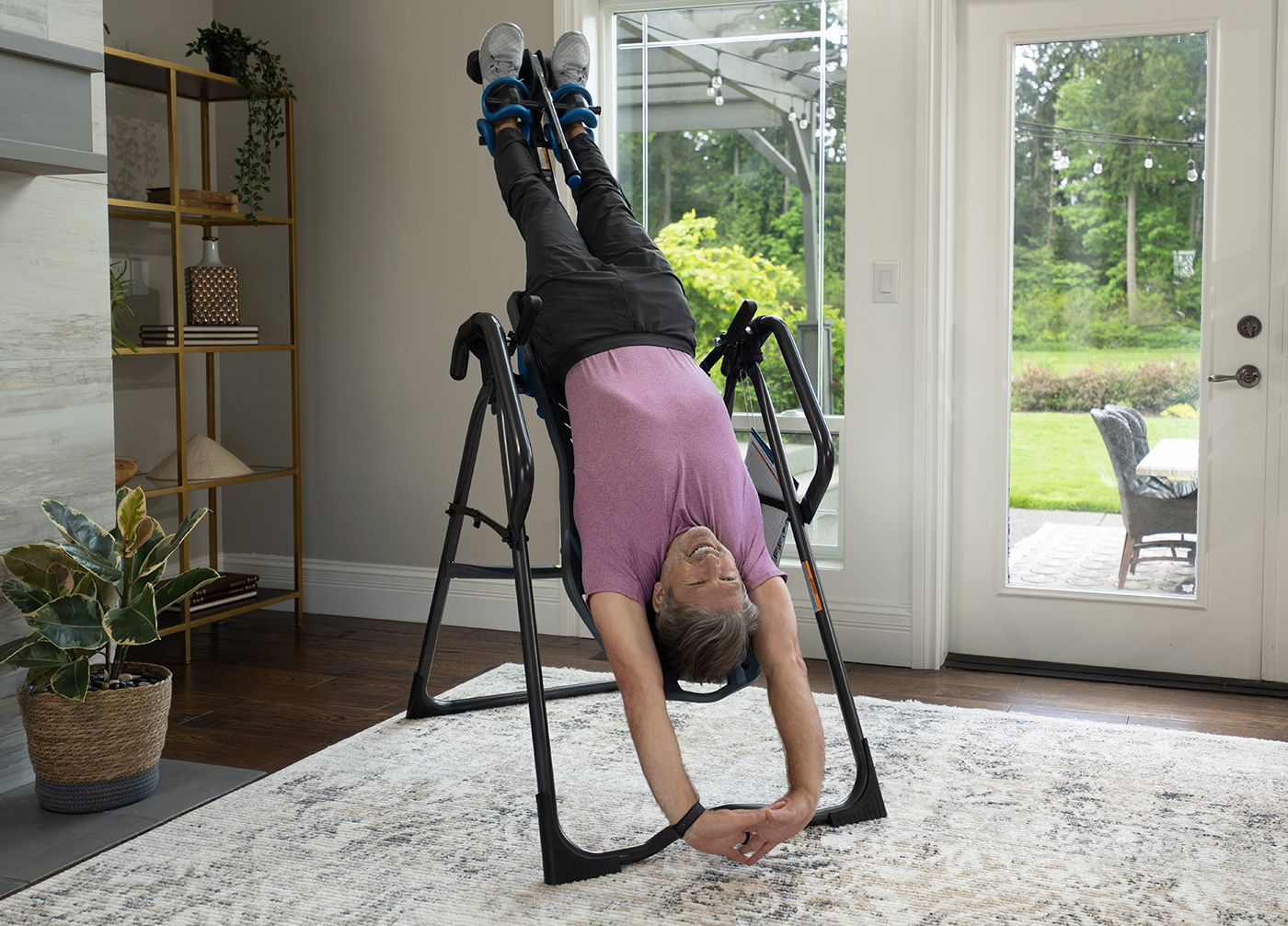 Man Relaxing on Teeter Inversion Table