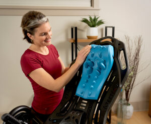 Woman using Myotrack Cushion on Inversion table