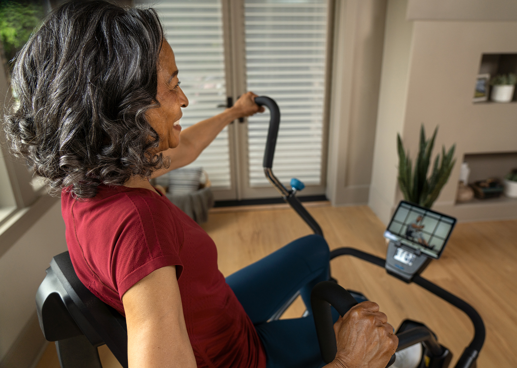 Woman Working Out on FreeStep Cross Trainer with Teeter Move App