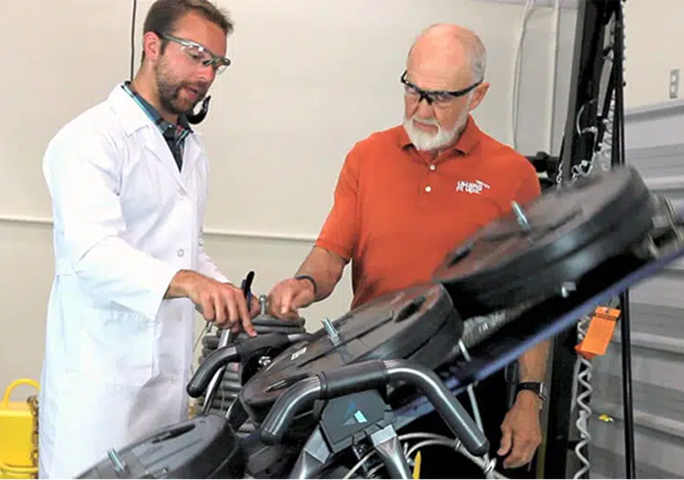 Teeter engineer performing quality testing on an inversion table