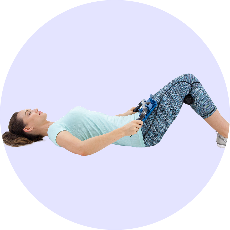 A woman lying down with the P2 Back Stretcher engaging in a moderate stretch